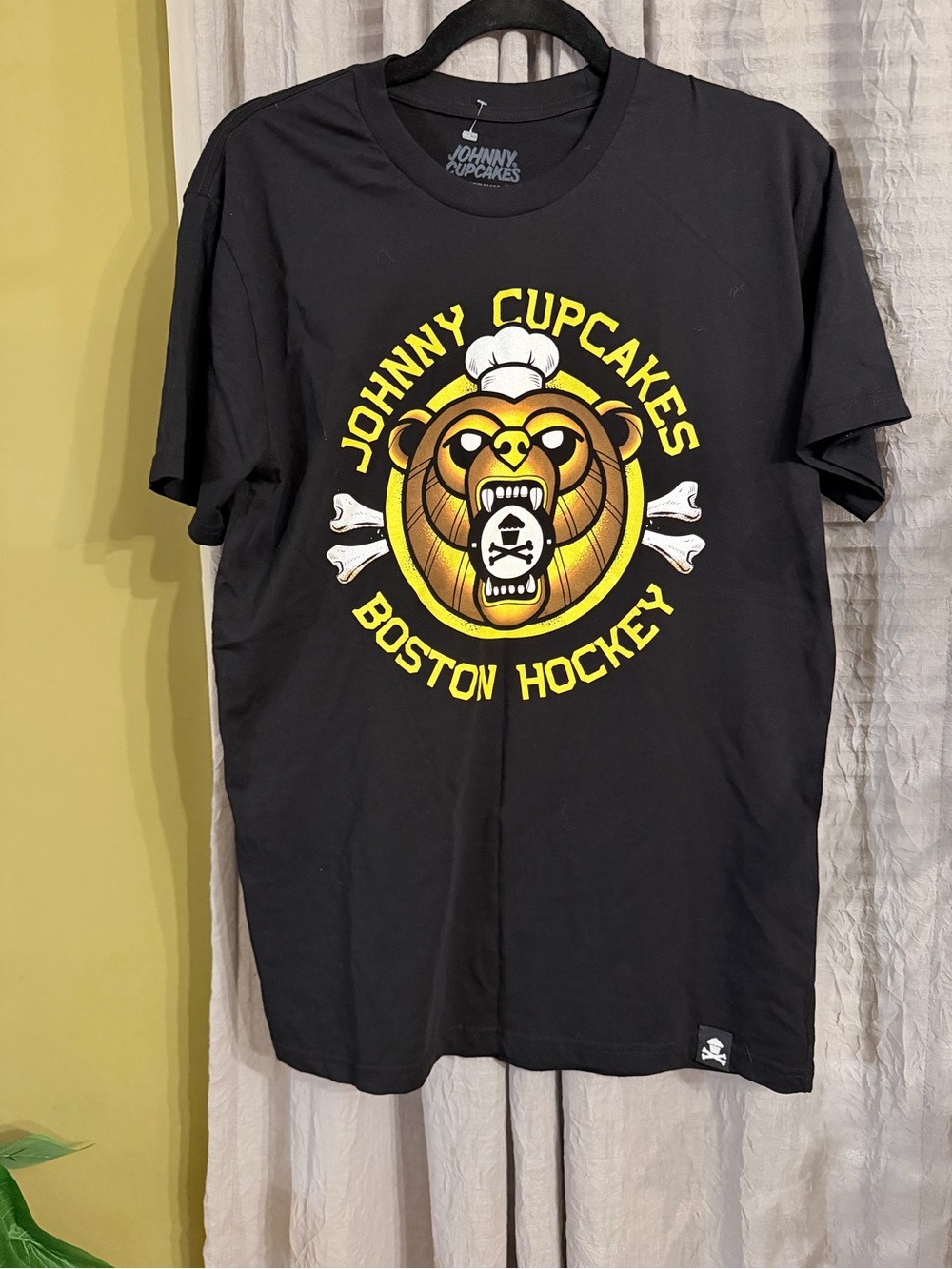 Johnny Cupcakes Black Tee with Yellow & Brown Bear Hockey Logo